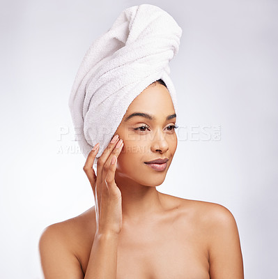 Buy stock photo Studio shot of a beautiful young woman posing against a white background