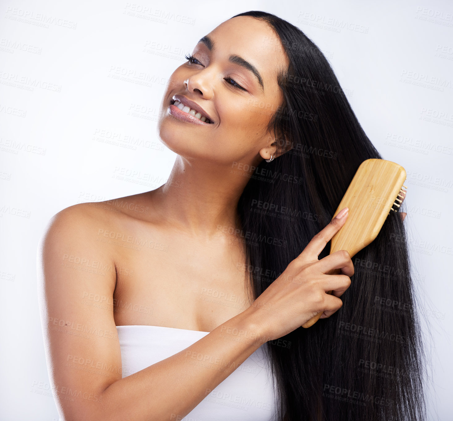 Buy stock photo Hair care, smile and woman with brush for beauty, salon or spa aesthetic and healthy scalp for growth in studio. Model girl, keratin texture and sustainable wood for hairbrush by white background