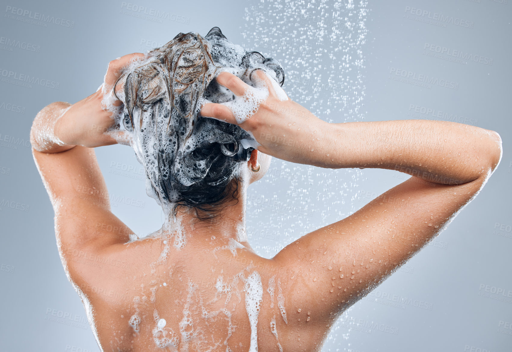 Buy stock photo Shower water, hair care and back of woman for hygiene, shine results and clean scalp for growth in studio. Liquid drops, model girl and foam wash for texture and cleaning routine by grey background