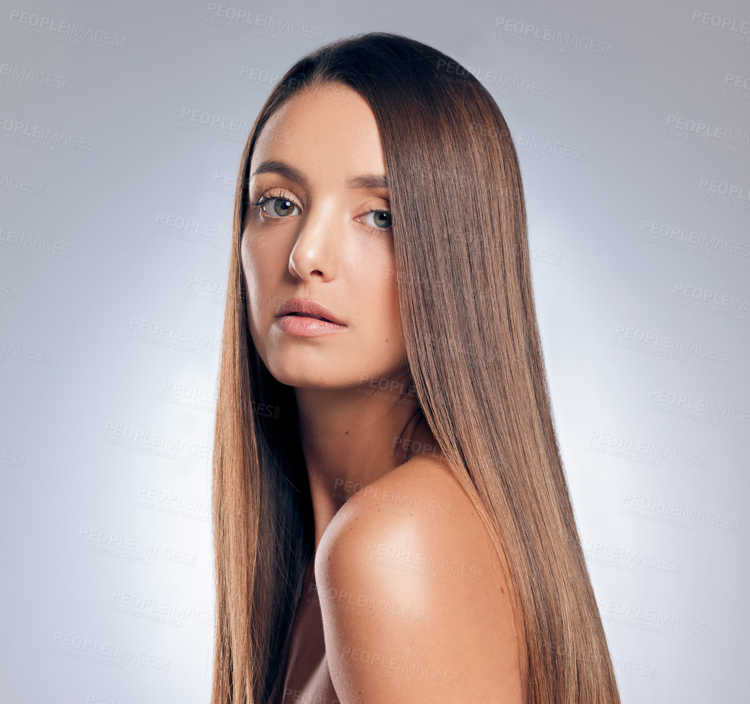 Buy stock photo Shot of an attractive young woman standing alone in the studio and posing