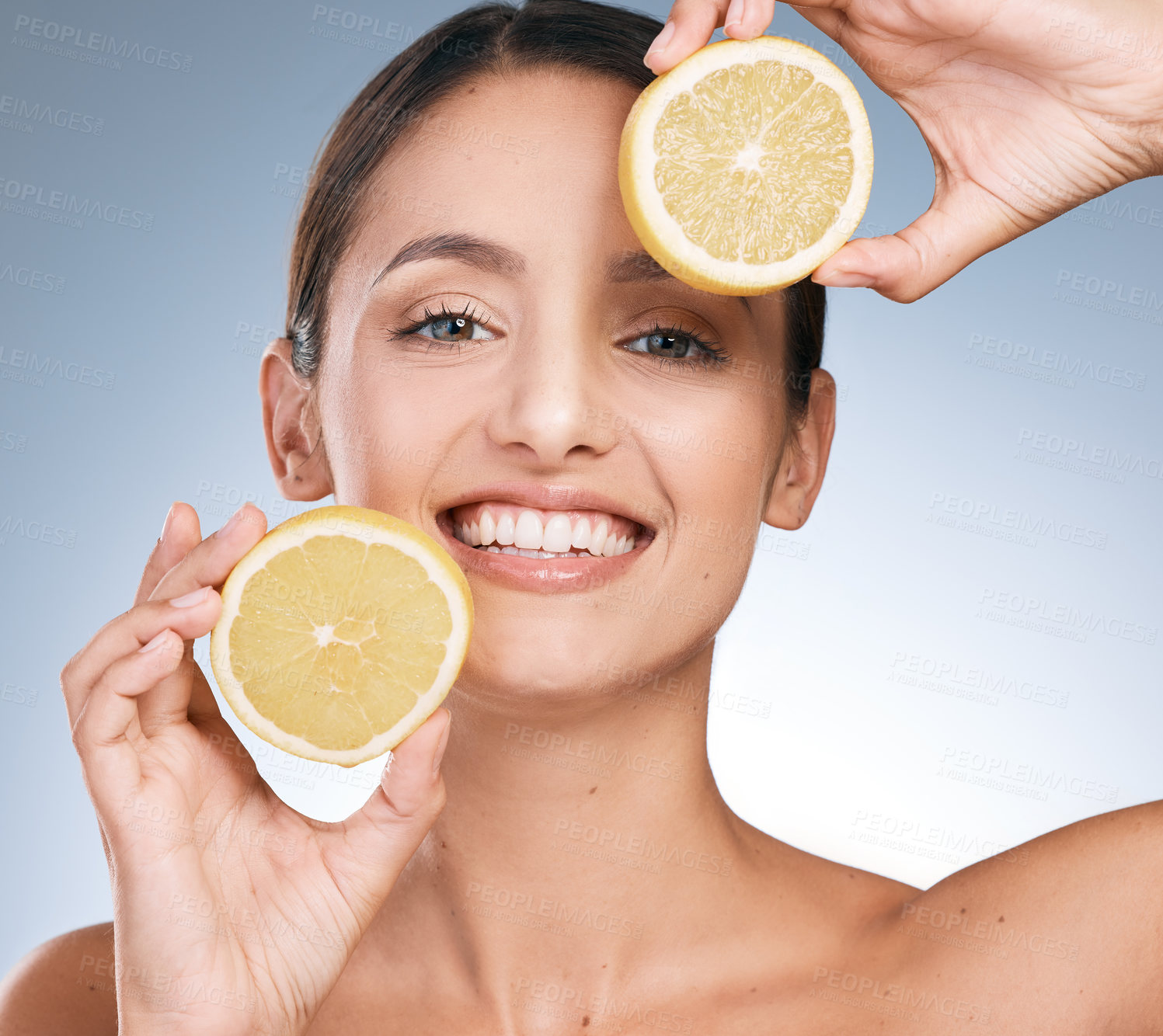 Buy stock photo Happy woman, skincare and portrait with orange slices in studio backdrop, satisfied by results in blue background. Female person, face and organic for cosmetic, pride or glow in dermatology or health