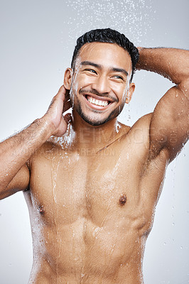 Buy stock photo Man in shower with smile, cleaning and studio background for hygiene with shampoo, healthy body. Water, skin and hair care, happy male model washing with happiness on backdrop with bathroom spa time.