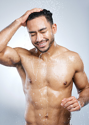Buy stock photo Man in shower with smile, washing body and happiness,  hygiene and healthy person on studio backdrop. Water, skin and hair care, happy male model cleaning with splash on background with bathroom spa.