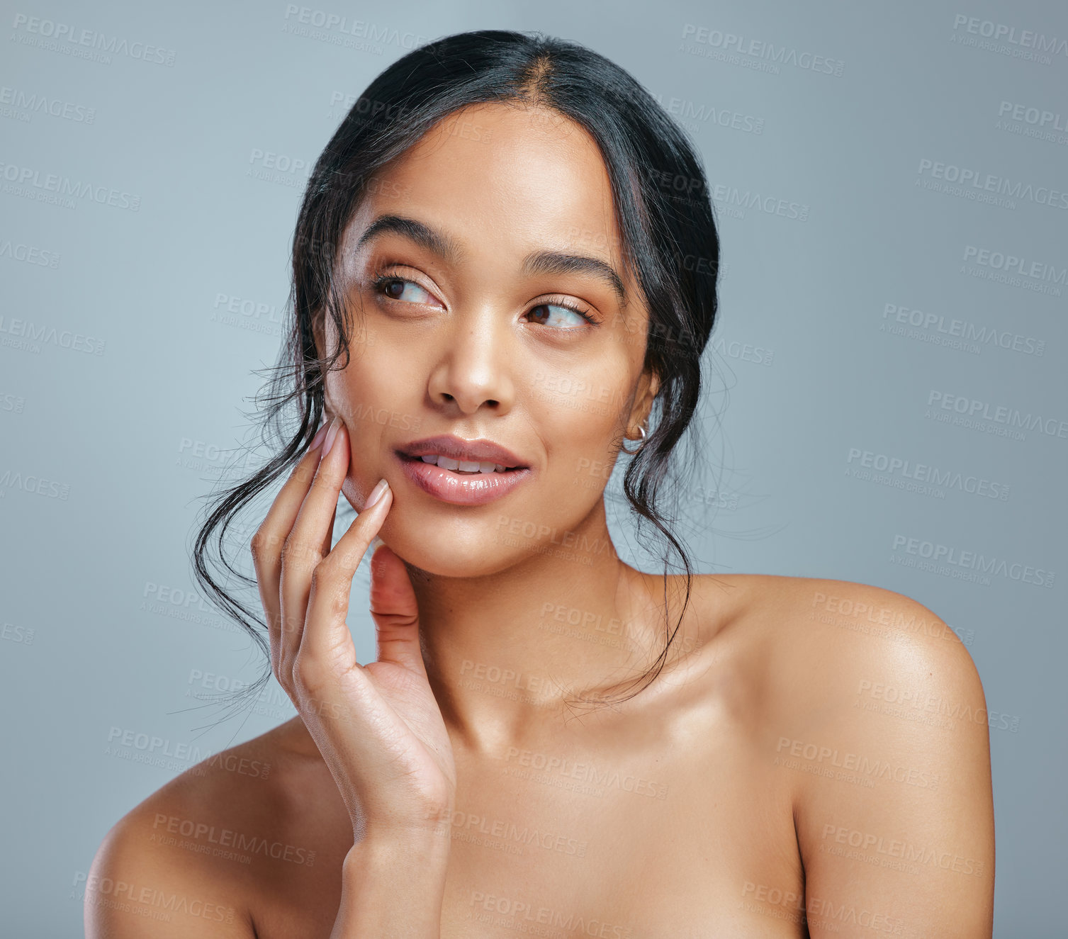 Buy stock photo Studio shot of an attractive young woman posing against a grey background