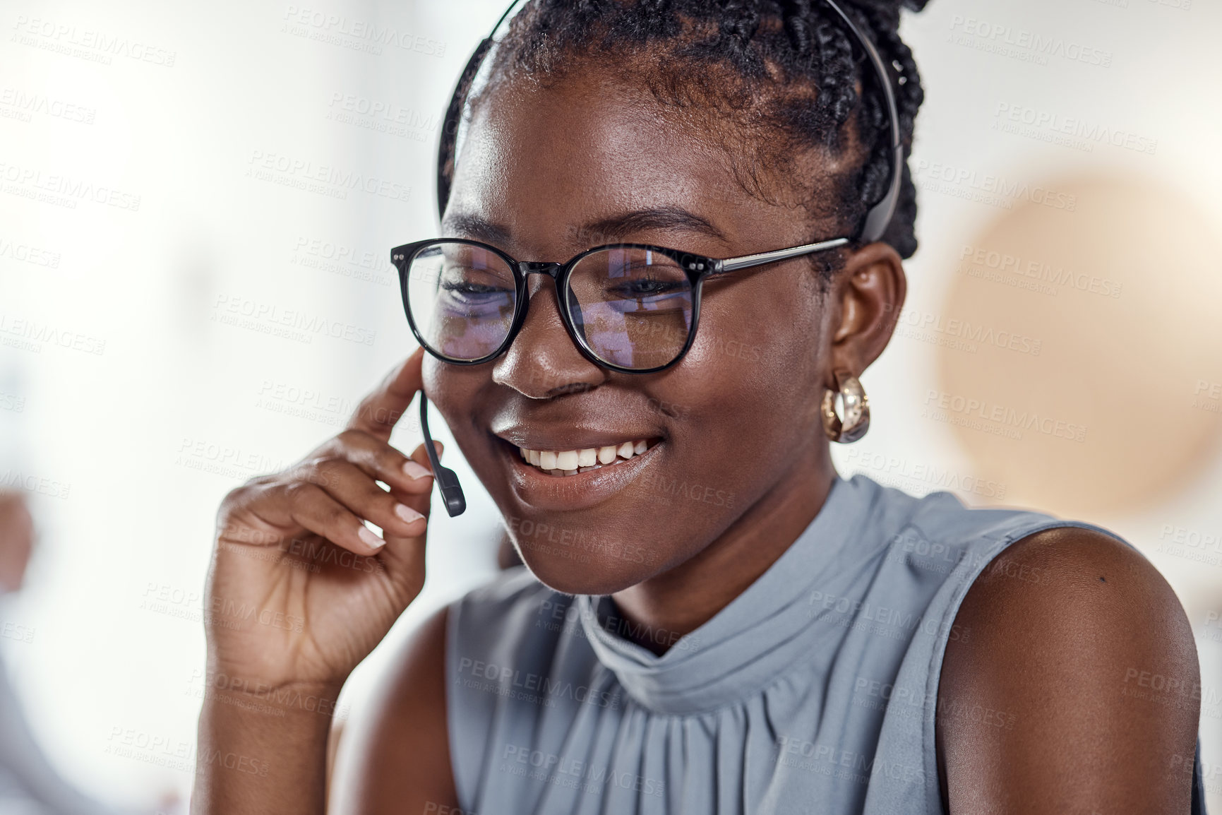 Buy stock photo Shot of a young woman using a headset in a modern office