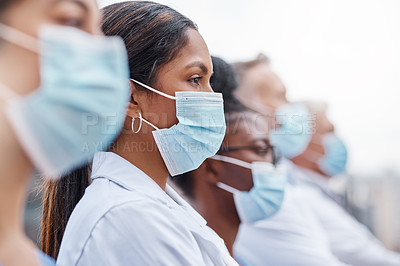 Buy stock photo Closeup shot of a group of doctors wearing masks