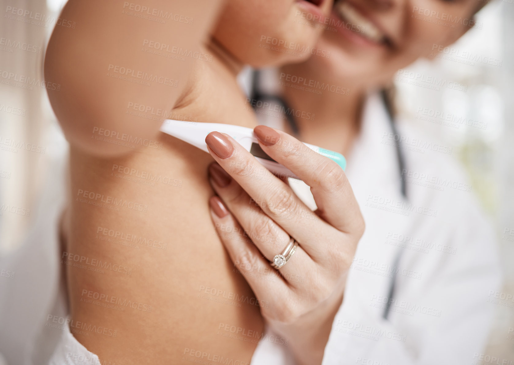 Buy stock photo Shot of a paediatrician taking a baby's temperature with a thermometer