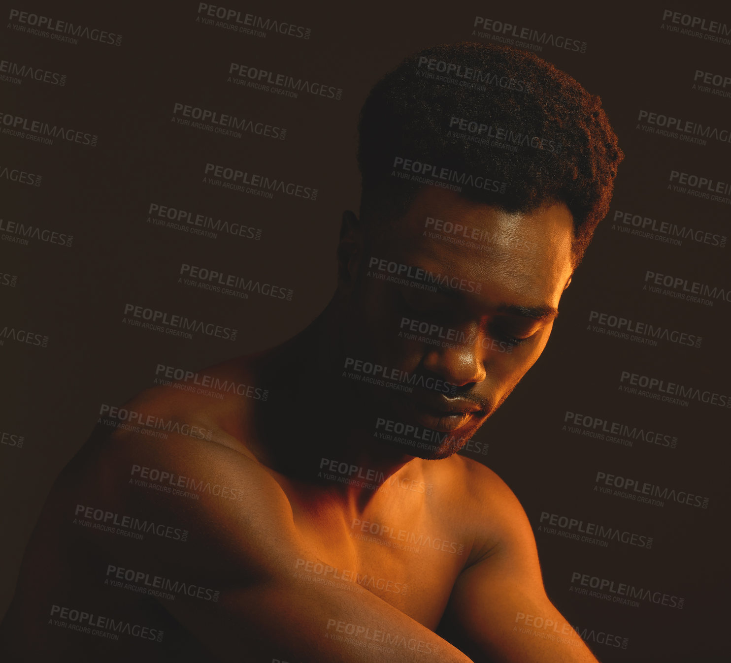 Buy stock photo Shot of a handsome young man posing in the studio