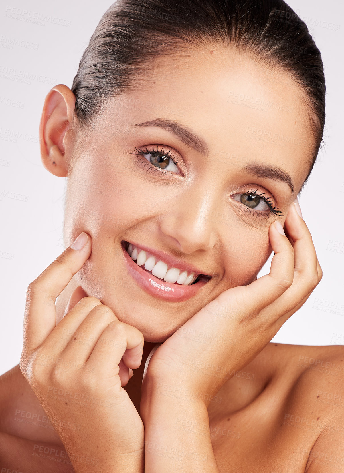 Buy stock photo Shot of an attractive young woman posing against a studio background