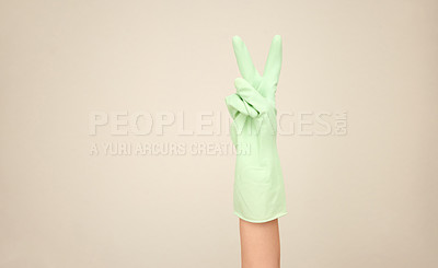 Buy stock photo Shot of an unrecognizable person showing a peace sign against a white background