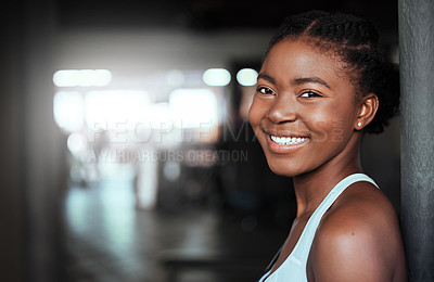 Buy stock photo Portrait of a young beautiful woman taking a break from her workout in the gym