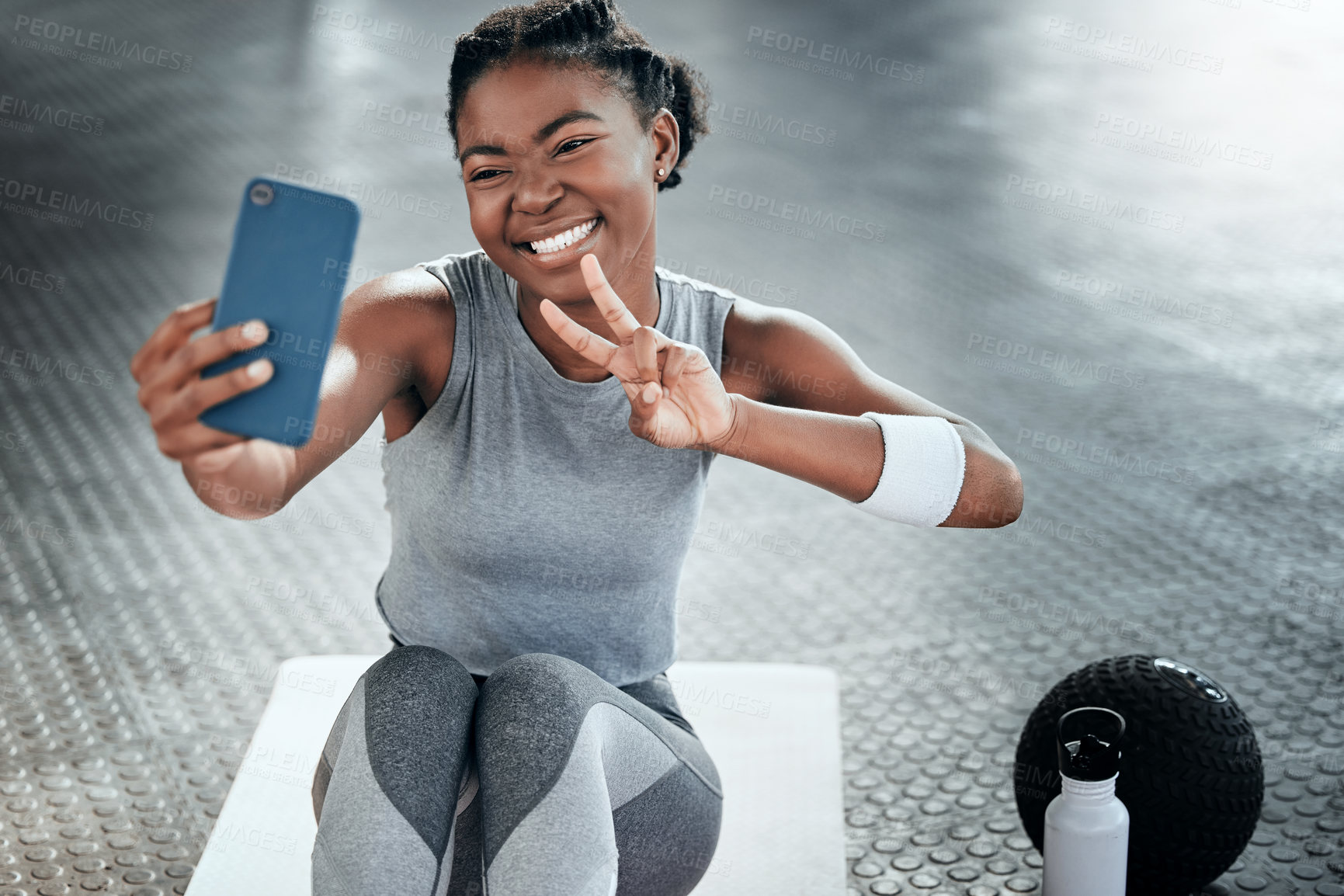Buy stock photo Black woman, gym selfie and peace with smile on floor for fitness, workout and wellness on social media app. Influencer girl, photography and blog for exercise, icon and health for lifestyle in club