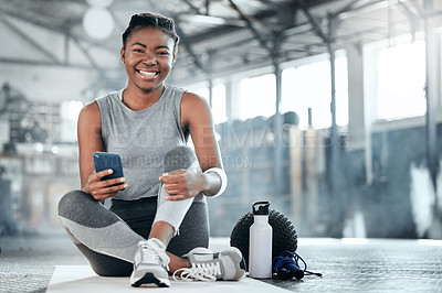 Buy stock photo Social media, smile or black woman with phone in gym to search for sports online in training or exercise. Fitness app, happy or healthy athlete relaxing or resting online mobile content on break 