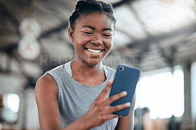 Buy stock photo Social media, happy or black woman with phone in gym to search for a sports blog in training or exercise. Fitness app, smile or healthy girl athlete relaxing or reading online mobile content on break