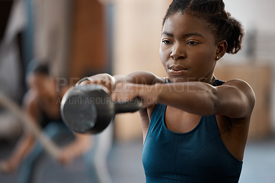 Buy stock photo Black woman, fitness and training with kettlebell in gym for muscle, wellness or body health challenge. Sport, strong bodybuilder and weightlifting for exercise, workout and power for energy in club