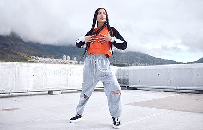 Buy stock photo Woman, hip hop and outdoor dancing in city for freedom with streetwear fashion, talent and movement with energy. Gen z girl, urban rooftop and creative dance or performance with fun passion for hobby