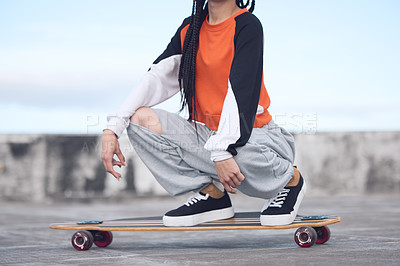 Buy stock photo Hip hop, fashion and woman on skateboard outdoor for freedom with streetwear, style inspiration and concrete floor. Gen z girl, urban rooftop and longboard for eco friendly transport and fun hobby