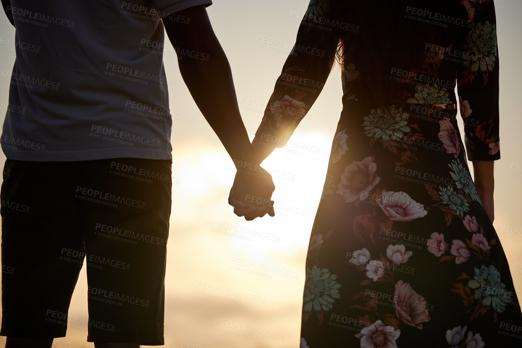 Buy stock photo Trust, love and couple holding hands in support of marriage, commitment and unity on sunset. Man, woman and people in solidarity of respect, empathy and care for hope in silhouette on Valentines Day