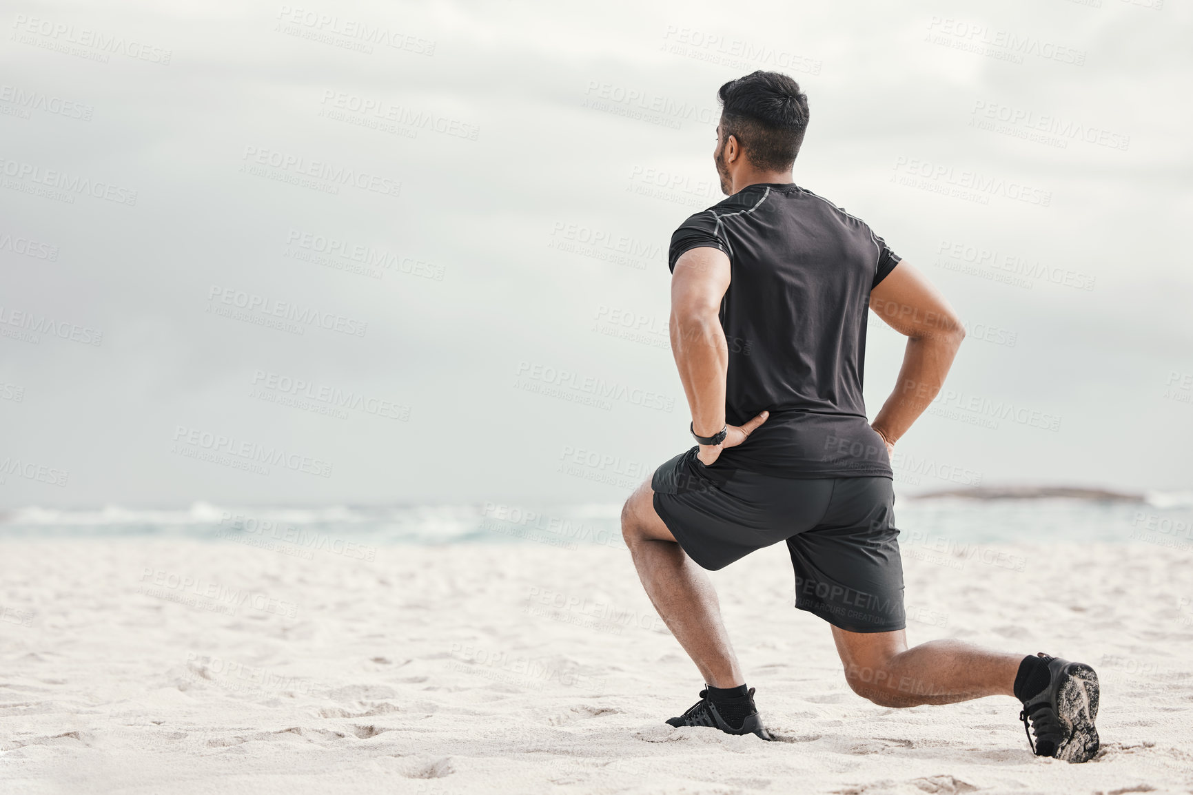 Buy stock photo Beach, lunges or man stretching legs with fitness for body flexibility, balance or wellness in running practice. Sea, sky or sports athlete ready for workout, mobility training or exercise warm up