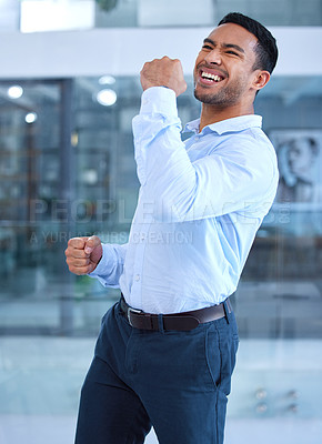 Buy stock photo Shot of a young businessman excitedly cheering