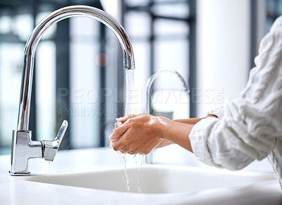 Buy stock photo Shot of a woman washing her hands