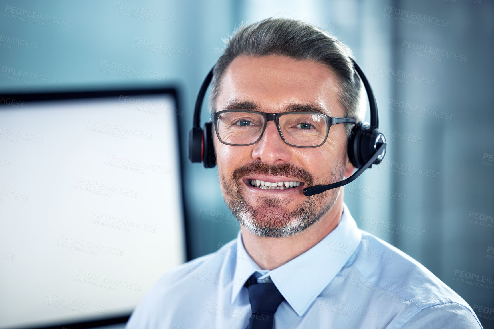 Buy stock photo Portrait of a call centre agent sitting at his desk