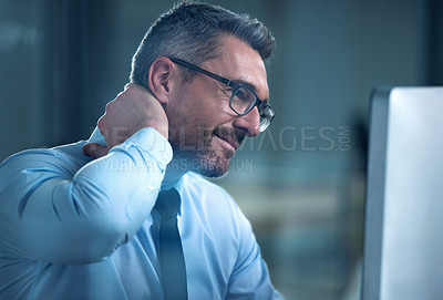 Buy stock photo Shot of a businessman suffering with neck pain while working at his desk