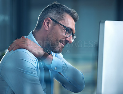 Buy stock photo Businessman, neck pain and stress in joints from arthritis, burnout and sitting at computer at night. Mature male person, website developer and tech in office for global company, project and overtime