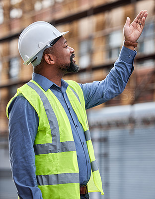 Buy stock photo Shot of a contractor posing outdoors at a construction site