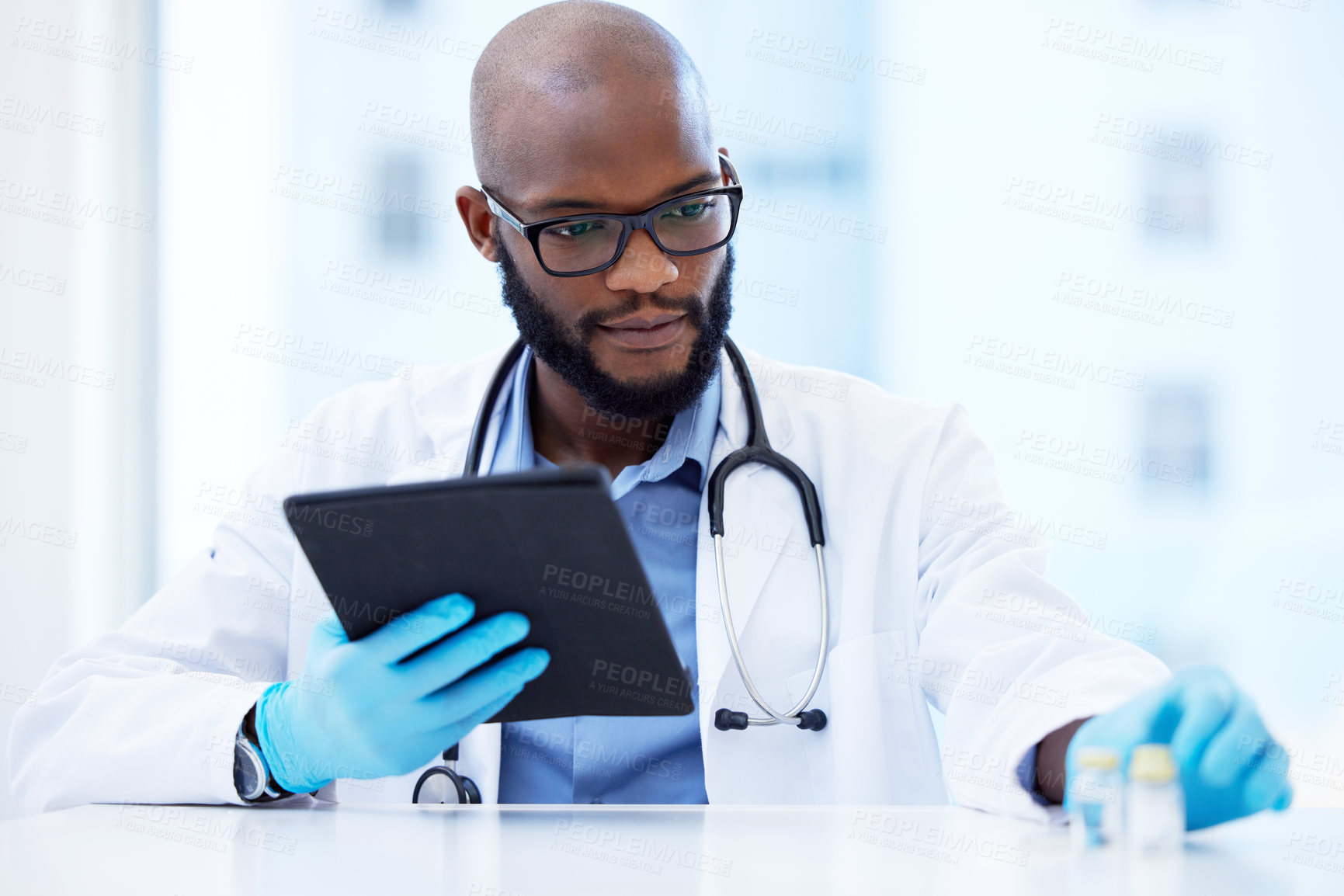 Buy stock photo Black man, doctor and cure with tablet for results or report as healthcare worker. Hospital, cardiologist and internet website for information or treatment guideline, medical or online research