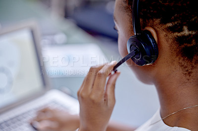 Buy stock photo Shot of an unrecognizable woman using a headset in a modern office