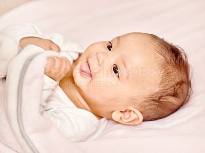 Buy stock photo Happy, infant and play with blanket on bed for child development or growth with sensory stimulation. Smile, baby and creative playtime or explore for fine motor skills with relax or comfort of house