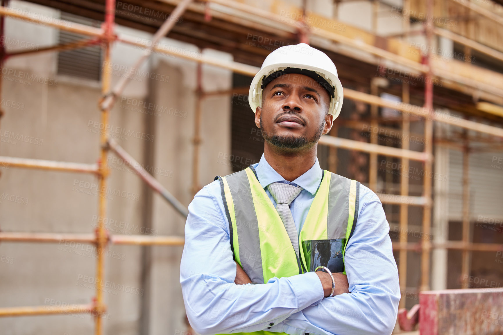 Buy stock photo Thinking, architect and black man at construction site for planning, creative or vision outdoor in city. Serious engineer, professional and idea for building, problem solving or property development