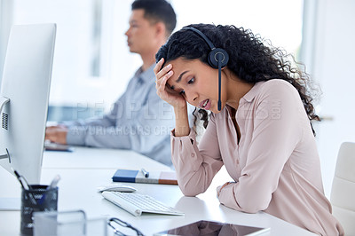 Buy stock photo Tired, headache and businesswoman with headset in office for career, call agent or telecommunication. Employee, female person or consultant for advice, support or answer questions in customer service