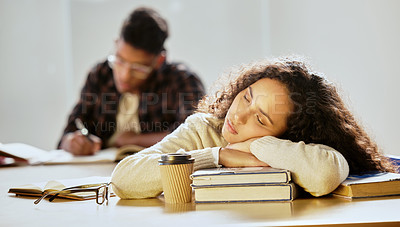 Buy stock photo Cropped shot of an attractive young female college student sleeping on her textbooks in class