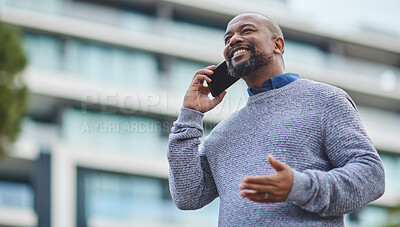 Buy stock photo Cropped shot of a handsome mature businessman making a phonecall while out in the city