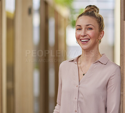 Buy stock photo Cropped portrait of an attractive young businesswoman standing in a hallway in her office