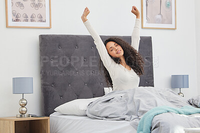 Buy stock photo Shot of a young female waking up in bed at home