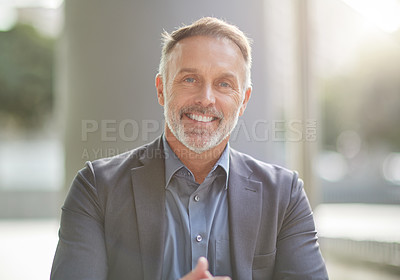 Buy stock photo Shot of a businessman sitting at his favourite coffee shop in the morning