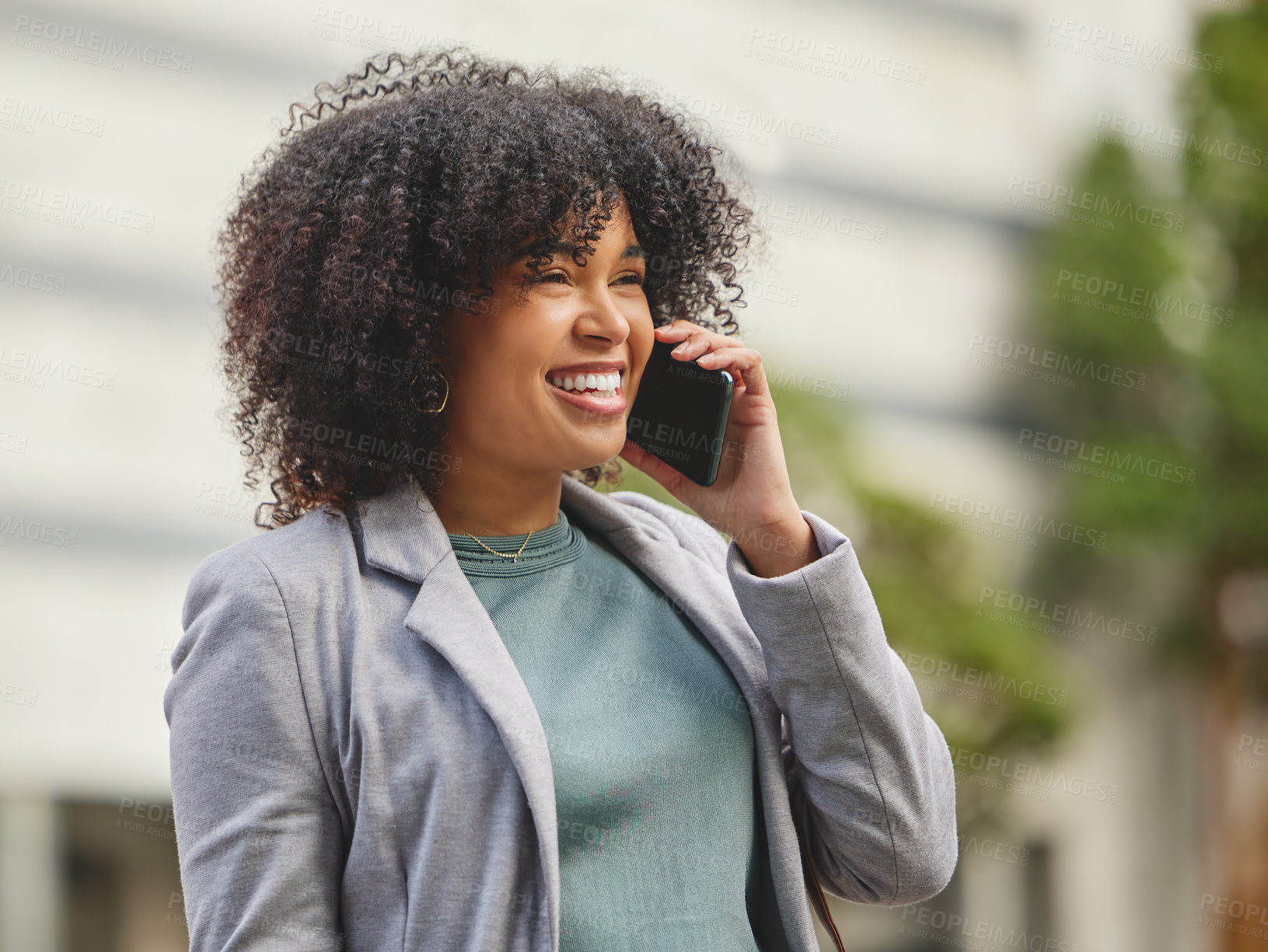 Buy stock photo Shot of a young businesswoman using her smartphone to make a phonecall