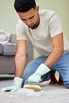 Buy stock photo Man, scrub and cleaning floor in house for hygiene, maintenance and washing carpet in living room. Male person, brush and soap on ground for disinfection, housekeeping and detergent in apartment