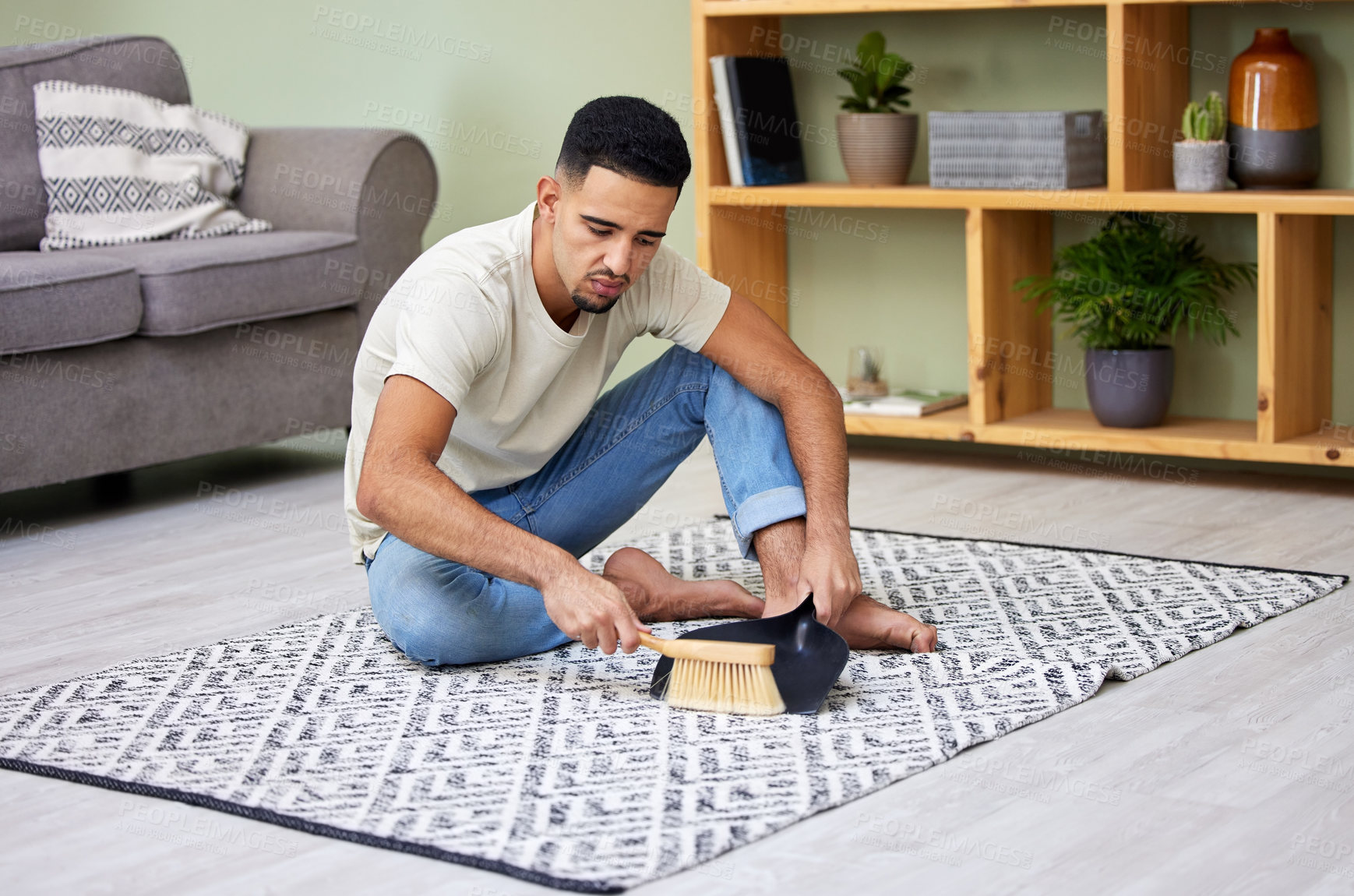 Buy stock photo Tired, man and cleaning floor with dustpan and brush for chores, housework and healthy routine. Serious, male person and sweeping ground of dust and germs for hygiene and safety of apartment or home