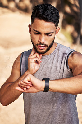 Buy stock photo Pulse, check and man or runner outdoor for morning cardio, exercise and training for marathon or race. Male athlete, smart watch or stopwatch to track heart rate for endurance, wellness and health.