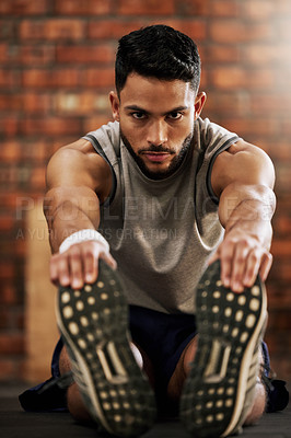 Buy stock photo Gym, feet and portrait of man stretching, workout warm up and motivation for fitness mindset. Focus, commitment and face of athlete on floor, stretch and training legs at sports club for health goals