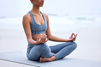 Buy stock photo Yoga, lotus meditation and hands at ocean for mindfulness, peace or calm to relax at sea in nature. Zen, beach and woman in padmasana pose for exercise, fitness and wellness for body health outdoor
