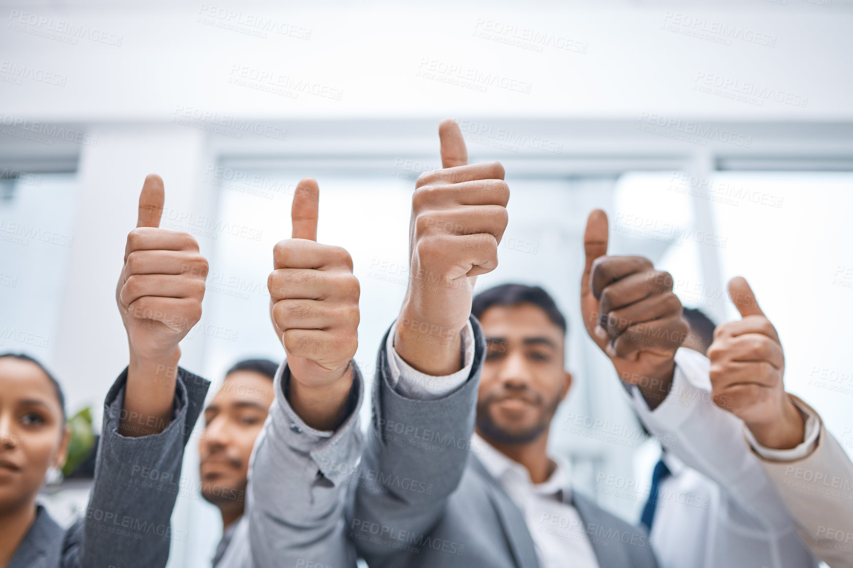 Buy stock photo Teamwork, hands and business people with thumbs up in office for good job, positive feedback or success on legal case. Lawyer, diversity and employees with gesture for yes sign, approval or winning