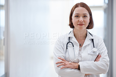 Buy stock photo Shot of a beautiful young doctor in the hospital