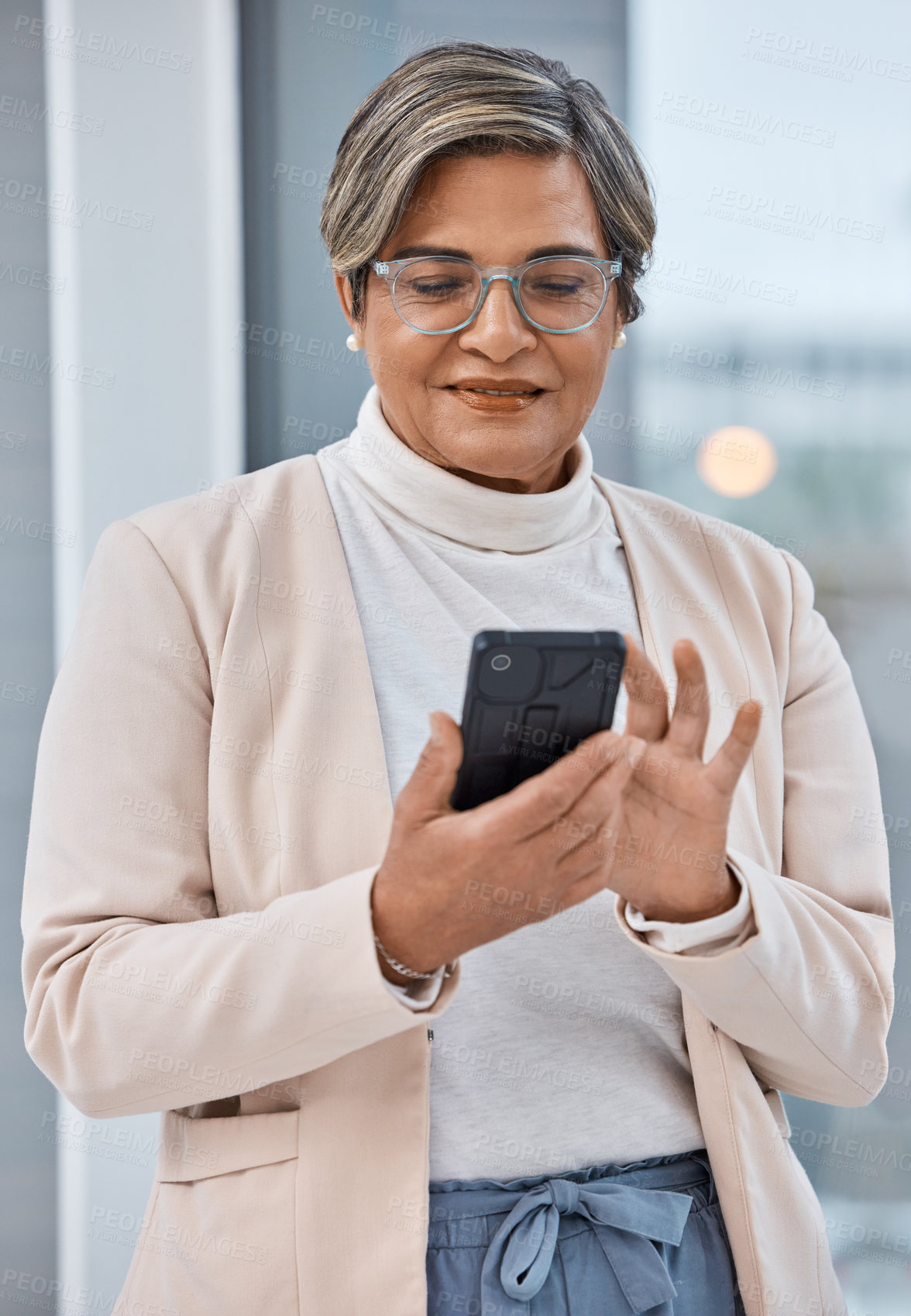 Buy stock photo Mature woman, phone and typing in office, checking email or social media for business website. Cellphone, scroll and businesswoman ceo surfing internet for networking, search and reading online post.