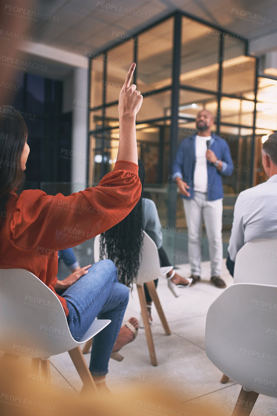 Buy stock photo Shot of an unrecognizable businessperson raising their hand to ask a question during a conference at work