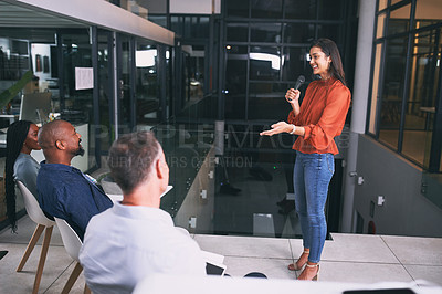 Buy stock photo Shot of a young businesswoman talking during a conference at work